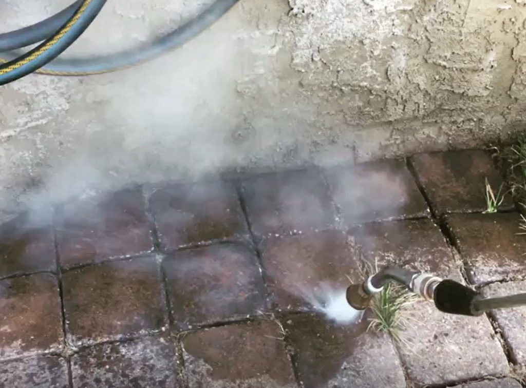 A fire hydrant spraying water on the ground.